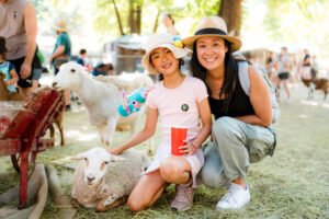 Farmer Darryl's Mobile Animal Farm at Easter with children in plenty a
